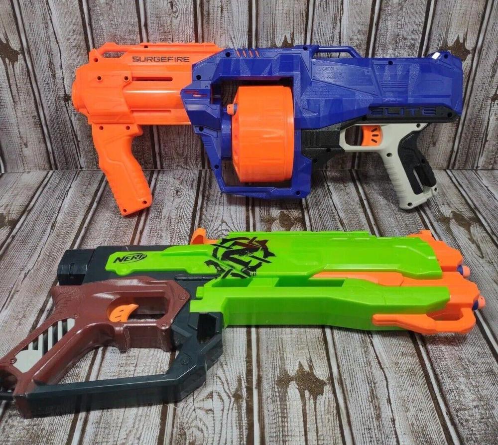NERF GUN LOT Strike Elite Surgefire Drum 15 Round and Zombie Strike 4 Round